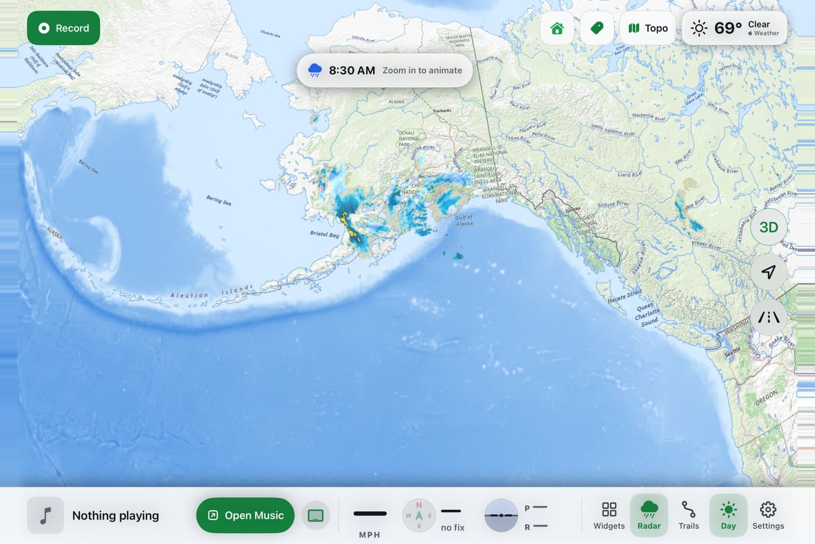 XRoad zoomed out over Alaska with live precipitation radar and the footer of music and ride readouts (simulator)
